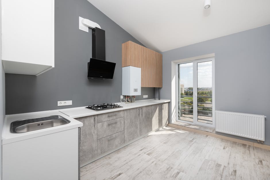Modern kitchen and living area showing comprehensive home remodeling